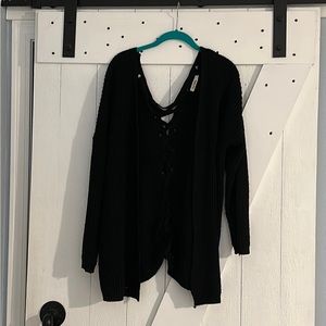 Black sweater, slight pilling reflected in price
